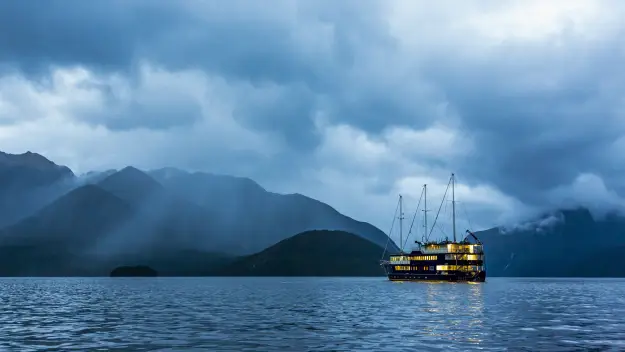 Doubtful Sound ship at dusk